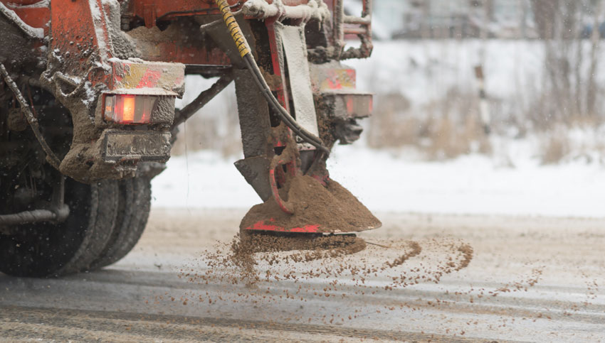 salt and sand spreading on winter roads